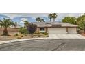 Exterior of house featuring desert landscaping, a three car garage, and solar panels at 3619 Bixbee Ct, Las Vegas, NV 89129