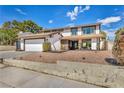 Well-maintained two-story home featuring a two-car garage, and nicely landscaped front yard at 3916 Green Leaf Dr, Las Vegas, NV 89120