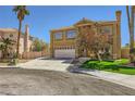 Charming two-story residence with a landscaped front yard and an attached two-car garage at 4 Bishopsgate Ter, Henderson, NV 89074