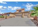 Charming two-story home with a three-car garage and desert landscaping at 4330 Oasis Hill Ave, North Las Vegas, NV 89085