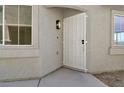 Welcoming front entrance featuring a secure security door and a modern lighting fixture at 4375 Pittsfield St, Las Vegas, NV 89115