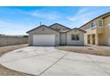 Charming single-story home featuring a well-maintained front yard and a spacious driveway leading to a two-car garage at 4375 Pittsfield St, Las Vegas, NV 89115