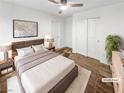Cozy main bedroom with a comfortable bed, ceiling fan, and closet at 6537 Ditmars St, Las Vegas, NV 89166