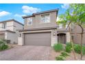 Beautiful two-story home boasts a two-car garage, tidy landscaping and a neutral color scheme at 7128 Port Stephens St, North Las Vegas, NV 89084
