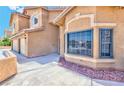 The exterior features an attractive stucco finish with modern windows and well-maintained landscaping at 7751 Locke Haven Dr, Las Vegas, NV 89123