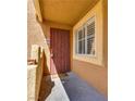 Inviting front door to home featuring security gate, covered entrance, and welcome mat at 7950 W Flamingo Rd # 2065, Las Vegas, NV 89147