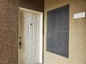 An inviting entrance featuring a bright, white door with secure lock system and well-lit surroundings at 8070 W Russell Rd # 1028, Las Vegas, NV 89113