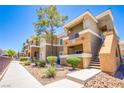 The building's exterior showcasing well-maintained landscaping and architectural details at 8070 W Russell Rd # 1028, Las Vegas, NV 89113