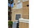 A modern building with visible air conditioning unit, stucco facade and well-maintained exterior at 8070 W Russell Rd # 1028, Las Vegas, NV 89113