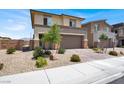 Two-story home featuring a brick driveway, landscaped front yard, and neutral color scheme at 8870 Sasquatch Run Ave, Las Vegas, NV 89166