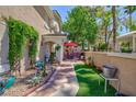 Cozy backyard patio with artificial turf, perfect for outdoor gatherings at 915 Graceful Moon Ave, Henderson, NV 89015