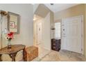 Cozy entryway featuring tile floors, neutral walls, and a white front door at 1007 Shades End Ave, North Las Vegas, NV 89081
