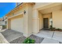 Charming home exterior featuring a two-car garage and covered entryway at 1007 Shades End Ave, North Las Vegas, NV 89081