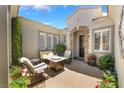 Cozy courtyard featuring comfortable seating, a charming fireplace, and tasteful landscaping at 10579 Garden Rose Dr, Las Vegas, NV 89135