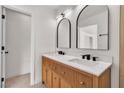 Elegant bathroom with double sinks, modern fixtures, and a classic design at 1705 Imperial Cup Dr, Las Vegas, NV 89117
