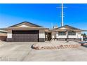 Charming single-story home with a well-maintained front yard and attached garage at 2368 Winterwood Blvd, Las Vegas, NV 89142