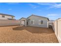 The backyard has low-maintenance gravel landscaping and block wall fencing for privacy at 2733 Avril Point St, Las Vegas, NV 89156