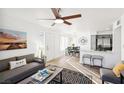 Inviting living room showcasing a modern kitchen with stainless appliances and an adjacent dining area at 3425 E Russell Rd # 202, Las Vegas, NV 89120