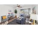 Bright living room showcasing modern decor and a sliding door to outdoor balcony at 3425 E Russell Rd # 202, Las Vegas, NV 89120