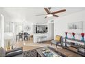 Open-concept living room featuring hardwood floors and neutral decor, creating a cozy and inviting atmosphere at 3425 E Russell Rd # 202, Las Vegas, NV 89120