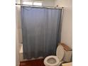 Cozy bathroom featuring a shower/tub combo with a blue patterned shower curtain at 3933 Lighthouse Ave, Las Vegas, NV 89110