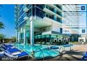 Luxurious pool deck with comfortable lounge chairs and umbrellas, offering relaxation with city views at 4381 W Flamingo Rd # 27309, Las Vegas, NV 89103