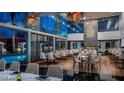 A stylish restaurant interior with contemporary decor and views of the pool area, perfect for dining at 4381 W Flamingo Rd # 27309, Las Vegas, NV 89103