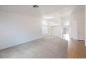 Spacious living room with plush carpeting, chandelier and lots of natural light at 4412 Red Blanket Rd, North Las Vegas, NV 89032