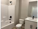 Bright bathroom features a shower-tub, modern vanity and black matte hardware at 4416 Cave Lake Ave, North Las Vegas, NV 89032