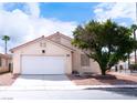 Beautiful single-story home featuring a two-car garage and mature landscaping in a quiet neighborhood at 5541 Alvarez St, North Las Vegas, NV 89031