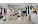 Cozy living room with decorative touches, tile floors, and lots of natural light at 604 I, Boulder City, NV 89005
