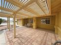 Covered patio with swing, ideal for outdoor relaxation and entertaining at 6460 Wagon Wheel Ct, Pahrump, NV 89061