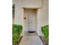 A welcoming condo entrance featuring a secure gate and well-maintained front yard landscaping at 6480 Annie Oakley Dr # 314, Las Vegas, NV 89120