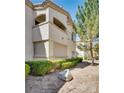 Exterior showcasing a condo with a balcony, framed by lush landscaping and a peaceful atmosphere at 6480 Annie Oakley Dr # 314, Las Vegas, NV 89120