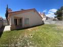 Fully fenced backyard with green grass, ideal for relaxing or entertaining in a private outdoor space at 6512 Sterling Springs Pkwy, Las Vegas, NV 89108