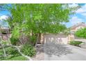Charming single-story home with a two-car garage and mature trees providing ample shade at 6631 Creeping Thyme St, Las Vegas, NV 89148