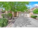 Well-maintained home features a two-car garage, manicured landscaping, and inviting front entrance at 6631 Creeping Thyme St, Las Vegas, NV 89148