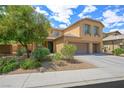 Well-maintained front yard with mature trees and shrubbery, complemented by a neutral stucco exterior and three-car garage at 6713 Guidestar St, North Las Vegas, NV 89084