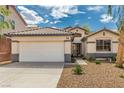 Inviting single-story home showcasing a two-car garage, desert landscaping, and a pleasant front entrance at 71 Blaven Dr, Henderson, NV 89002
