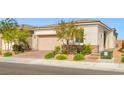 Well-maintained single-story home featuring a two-car garage, desert landscaping, and a paved driveway at 8668 Marcana St, Las Vegas, NV 89166