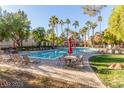Enjoy this community pool surrounded by palm trees, patio seating, and well-manicured landscaping at 9000 Las Vegas Blvd # 1016, Las Vegas, NV 89123