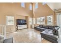Spacious living room featuring high ceilings, large windows, and tile flooring at 978 Valetta Flat Ave, Las Vegas, NV 89183