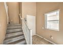 Staircase with painted wood steps and white railing at 978 Valetta Flat Ave, Las Vegas, NV 89183