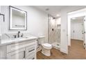 Bathroom features a vanity, white toilet, shower, and tile flooring. The space looks very modern at 1136 Casady Hollow Ave, Henderson, NV 89012