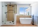 Spa bathroom offers a soaking tub with separate glass shower, a relaxing retreat at 1136 Casady Hollow Ave, Henderson, NV 89012