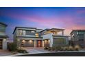 Contemporary two-story home featuring a three-car garage, modern architectural details, and a vibrant red front door at 11943 Rockview Point St, Las Vegas, NV 89138
