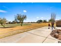 Expansive backyard with a patio overlooking a lush golf course and picturesque scenery at 1199 Golf Club, Laughlin, NV 89029