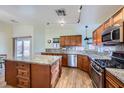 This spacious kitchen boasts granite countertops, stainless steel appliances, and a central island at 127 Mauve St, Henderson, NV 89012