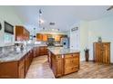 Spacious kitchen featuring a central island, granite countertops, and stainless steel appliances at 127 Mauve St, Henderson, NV 89012
