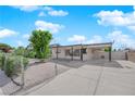 Single story home featuring desert landscaping and a covered parking area at 1800 Atlantic St, Las Vegas, NV 89104